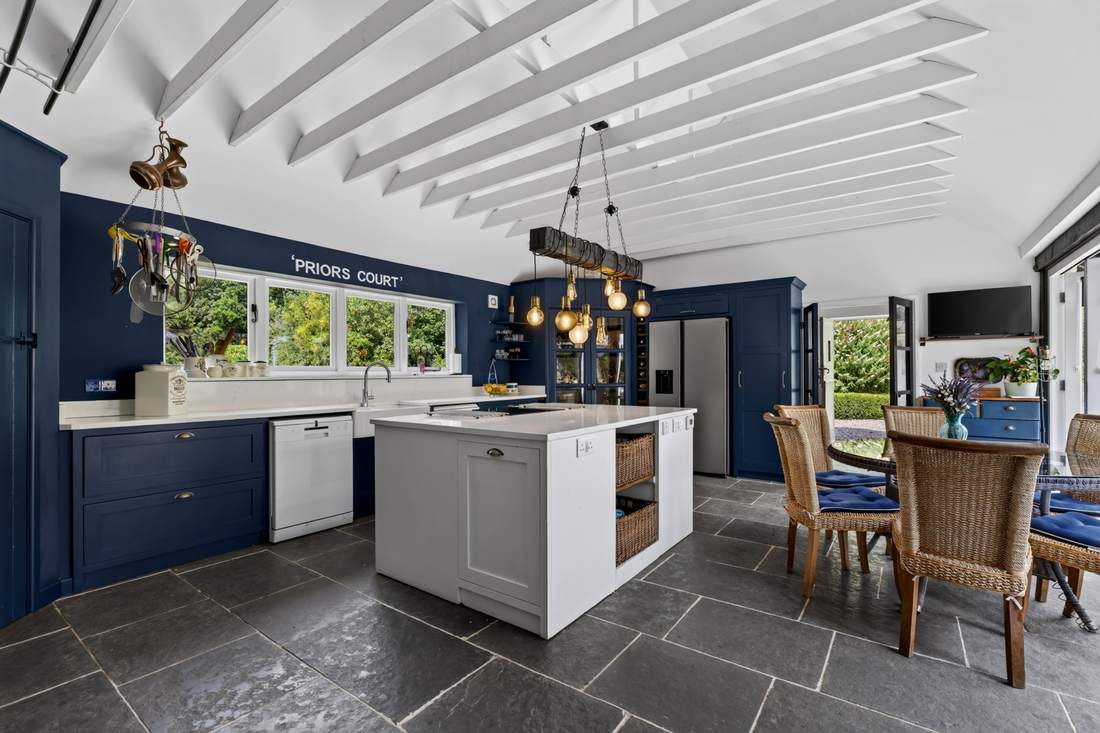 The kitchen at Priors Court, Aylton, with central island and adjoining dining area