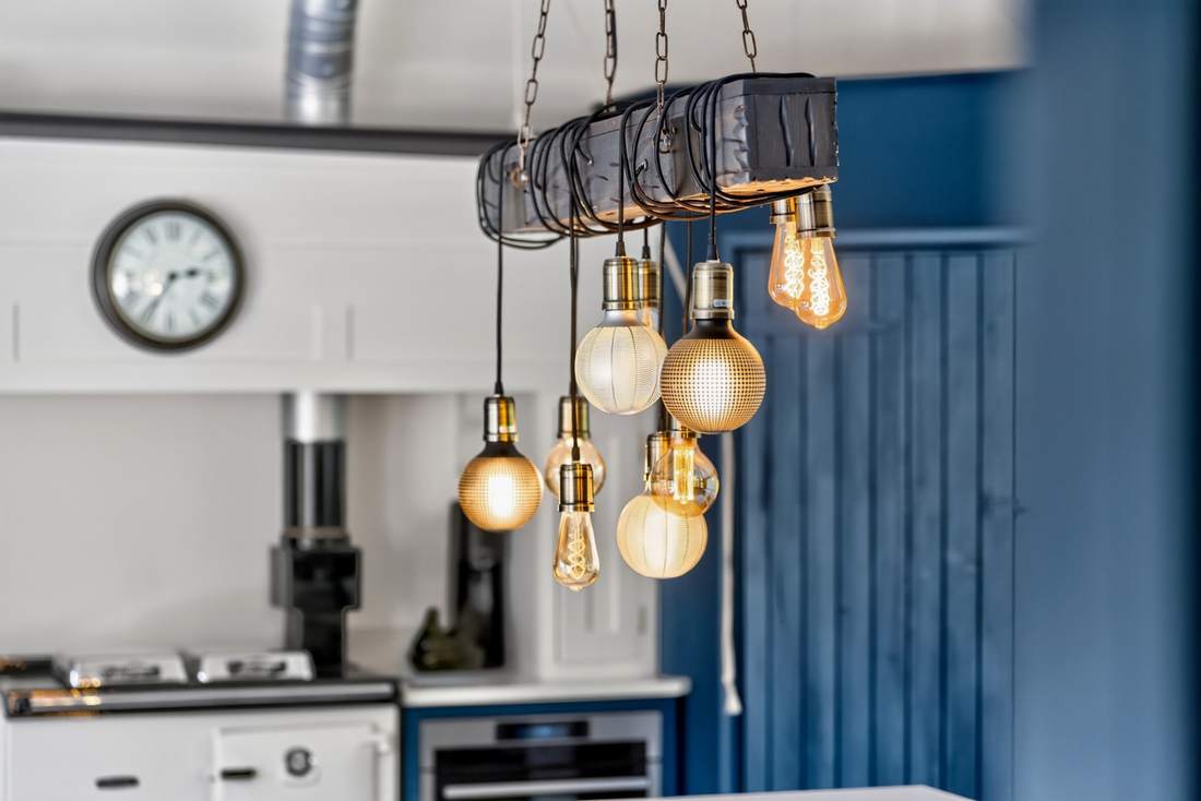 Pendant lighting above the kitchen island at Priors Court, Aylton